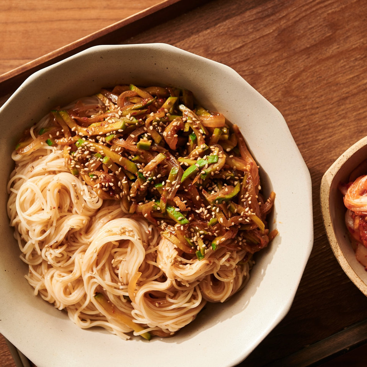 Thin noodles tossed with a glossy soy sauce dressing and sesame seeds